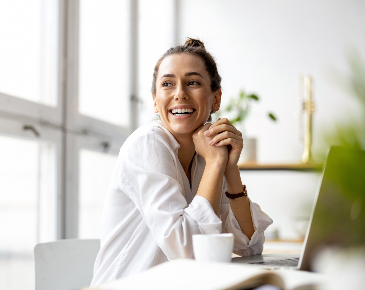 Woman smiling with computer